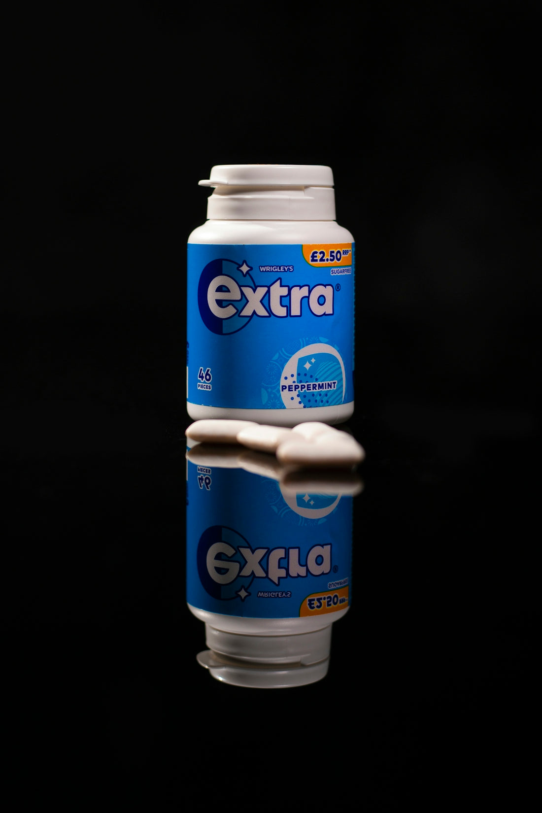 A can of extra toothpaste on a black background