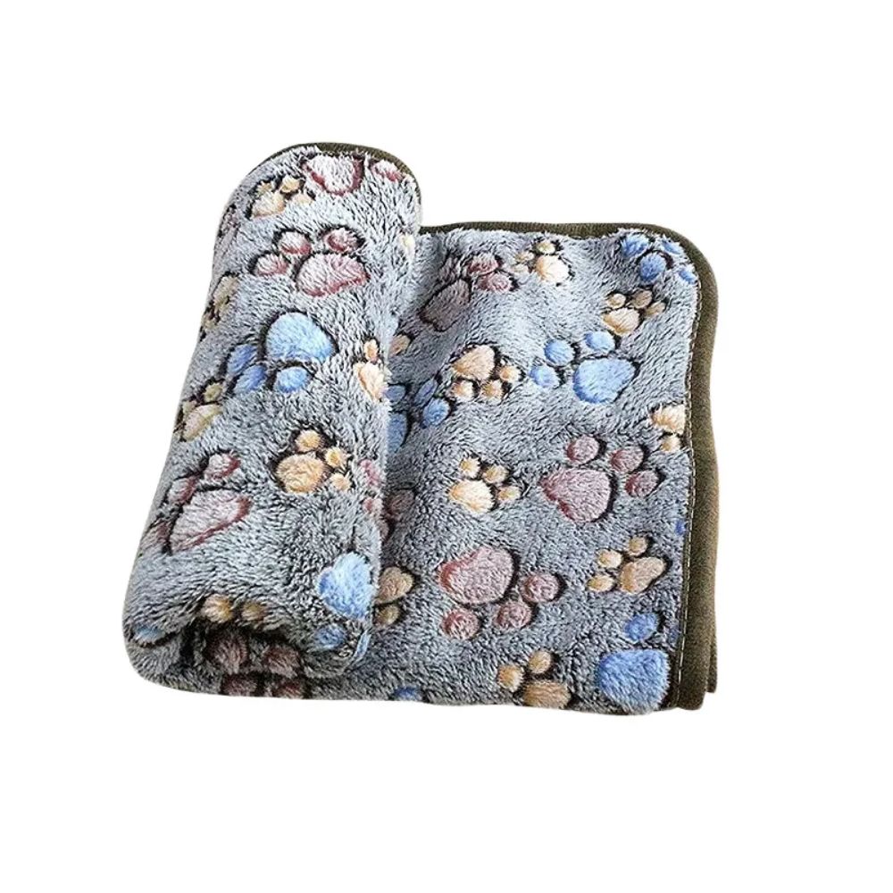 Detalle del material coral fleece de la manta para perro