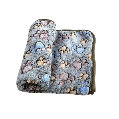 Detalle del material coral fleece de la manta para perro